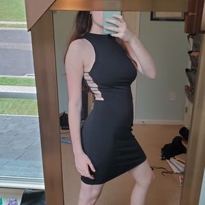 Form fitting black highness dress with cutouts